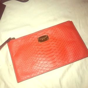 Orange Micheal kors wristlet/wallet